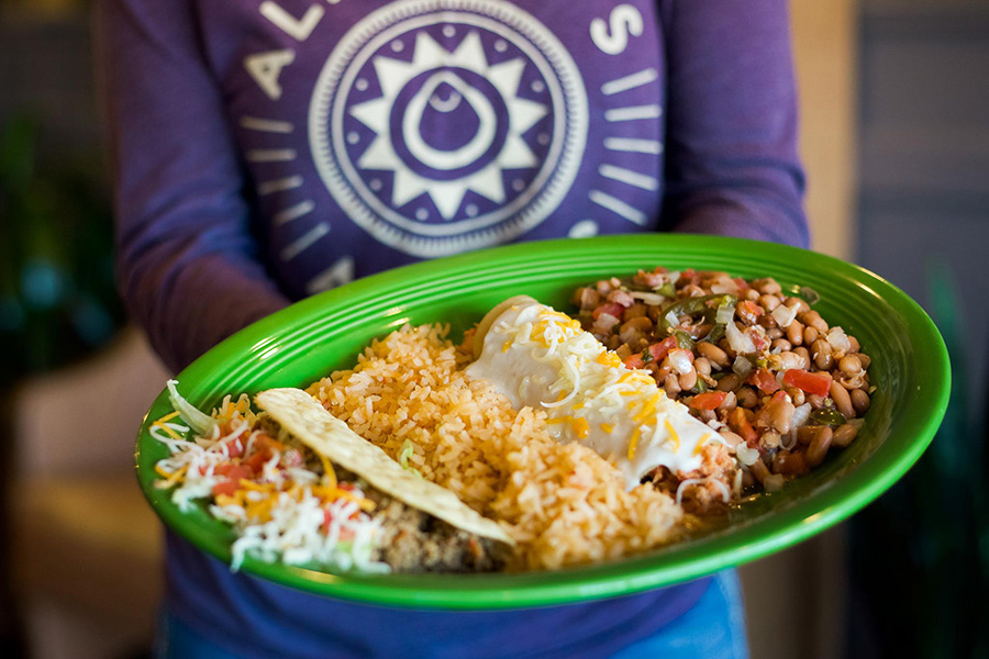 Alfredo's Mexican Cafe Server holding Mexican dish